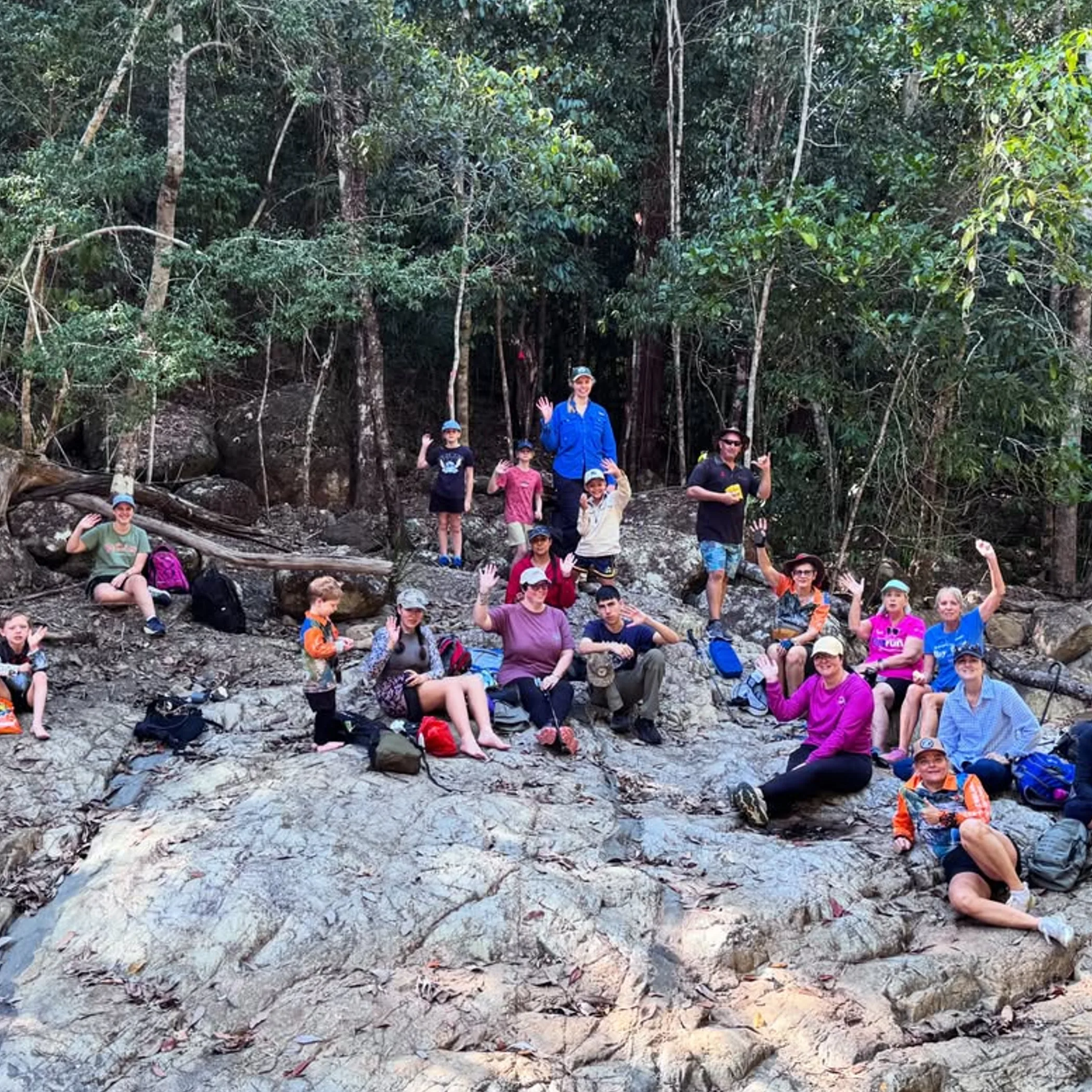 group hiking on forest trail