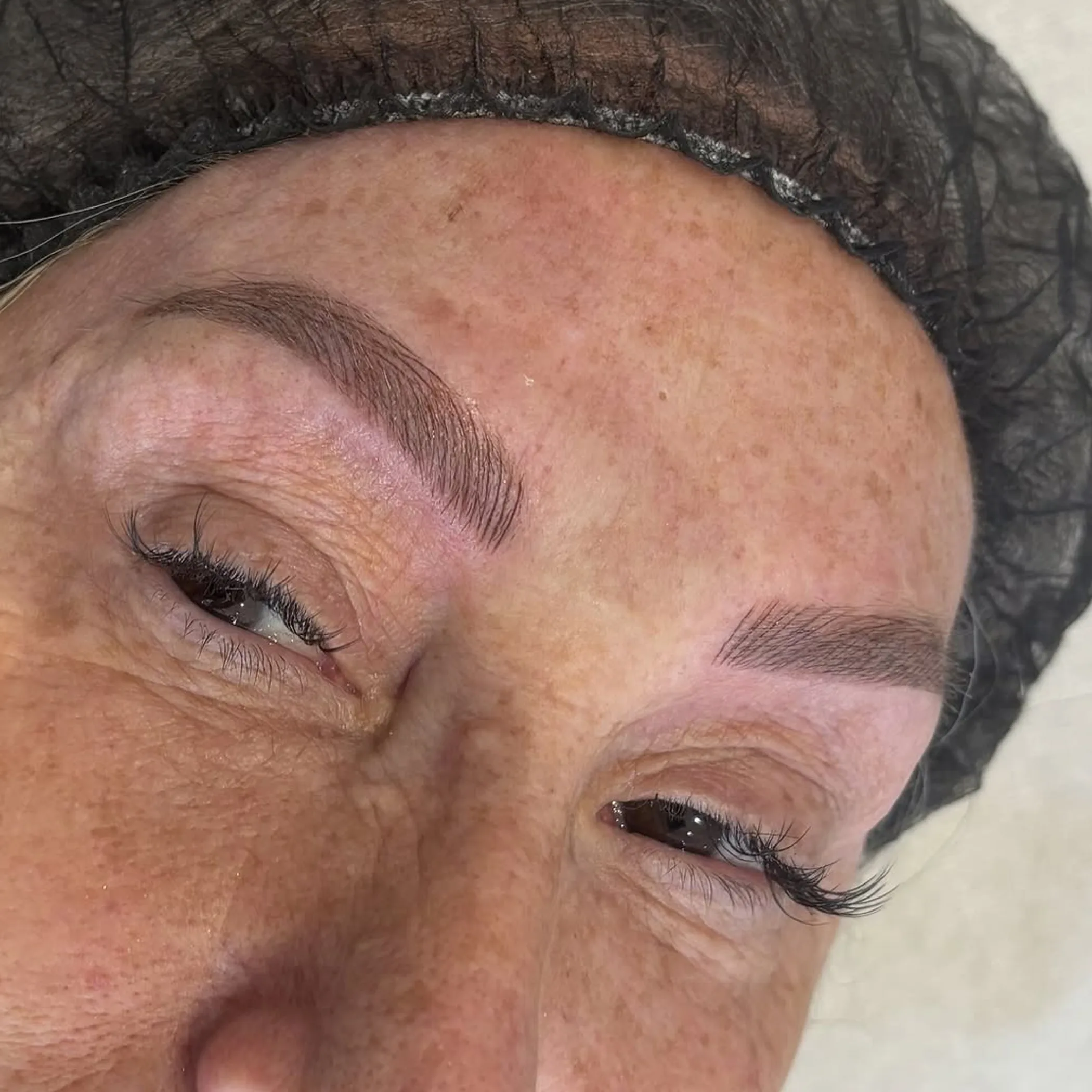 brow feathering over old tattoo