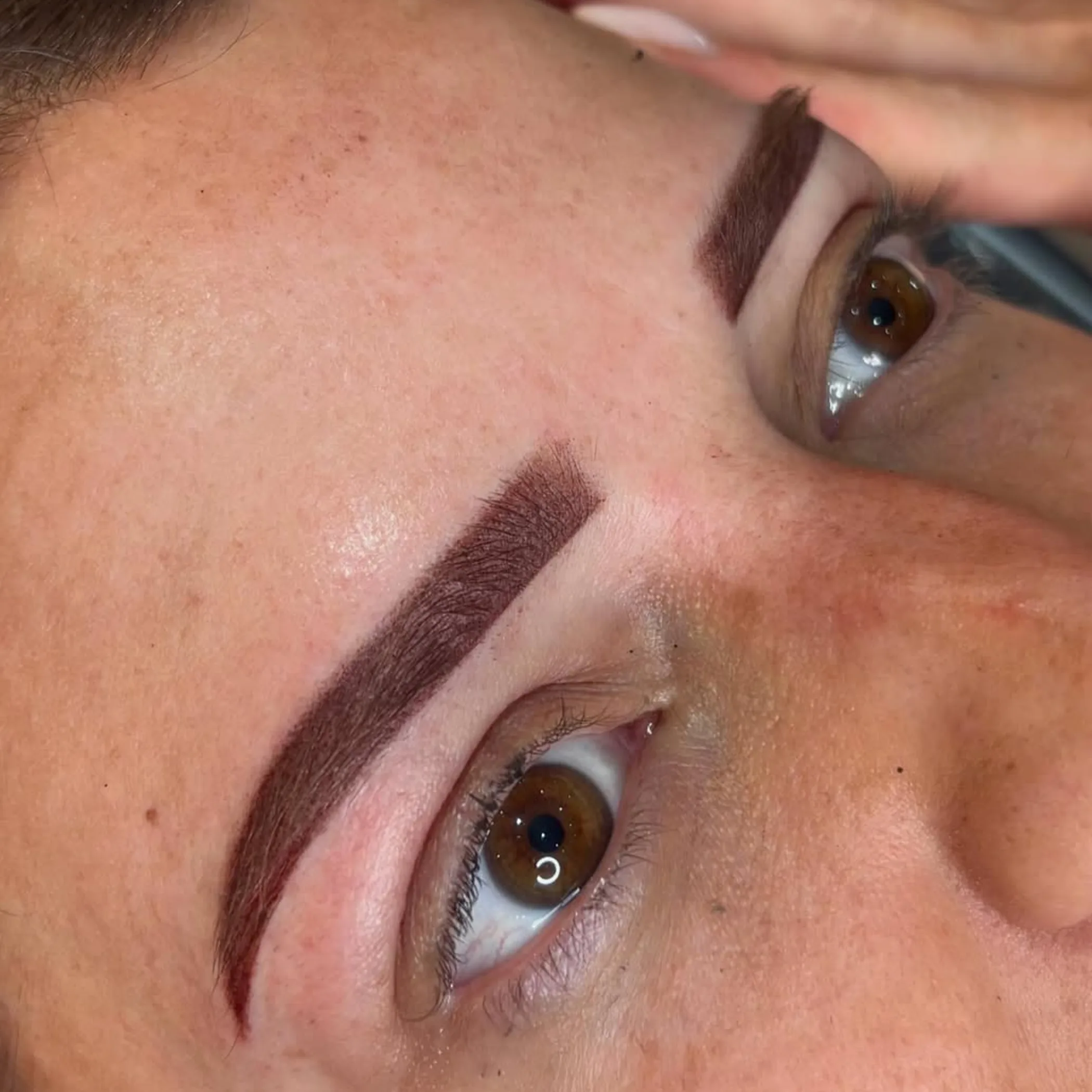 freshly tattooed brows